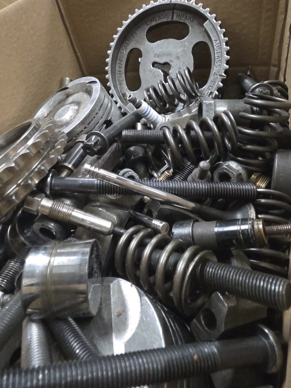A pile of reclaimed springs, gears, bolts and other metal parts