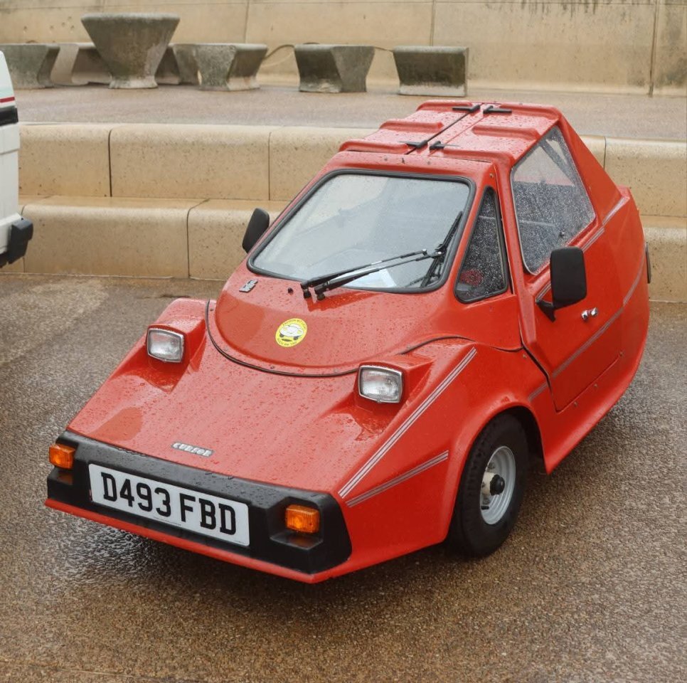 The small red Rebuild Custom toy car, a Replicar Cursor