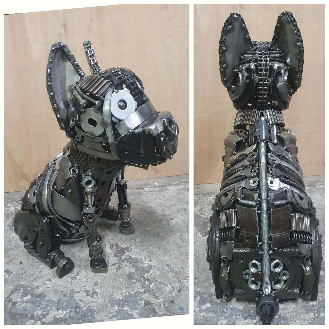 Scrap-metal dog sculpture shown from the side and rear