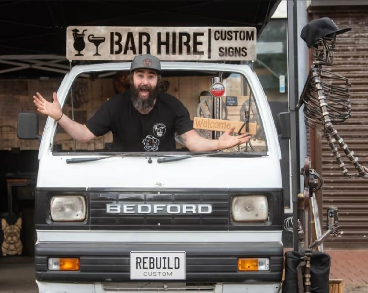 Jason welcoming visitors from behind the Bedford Rascal custom event bar