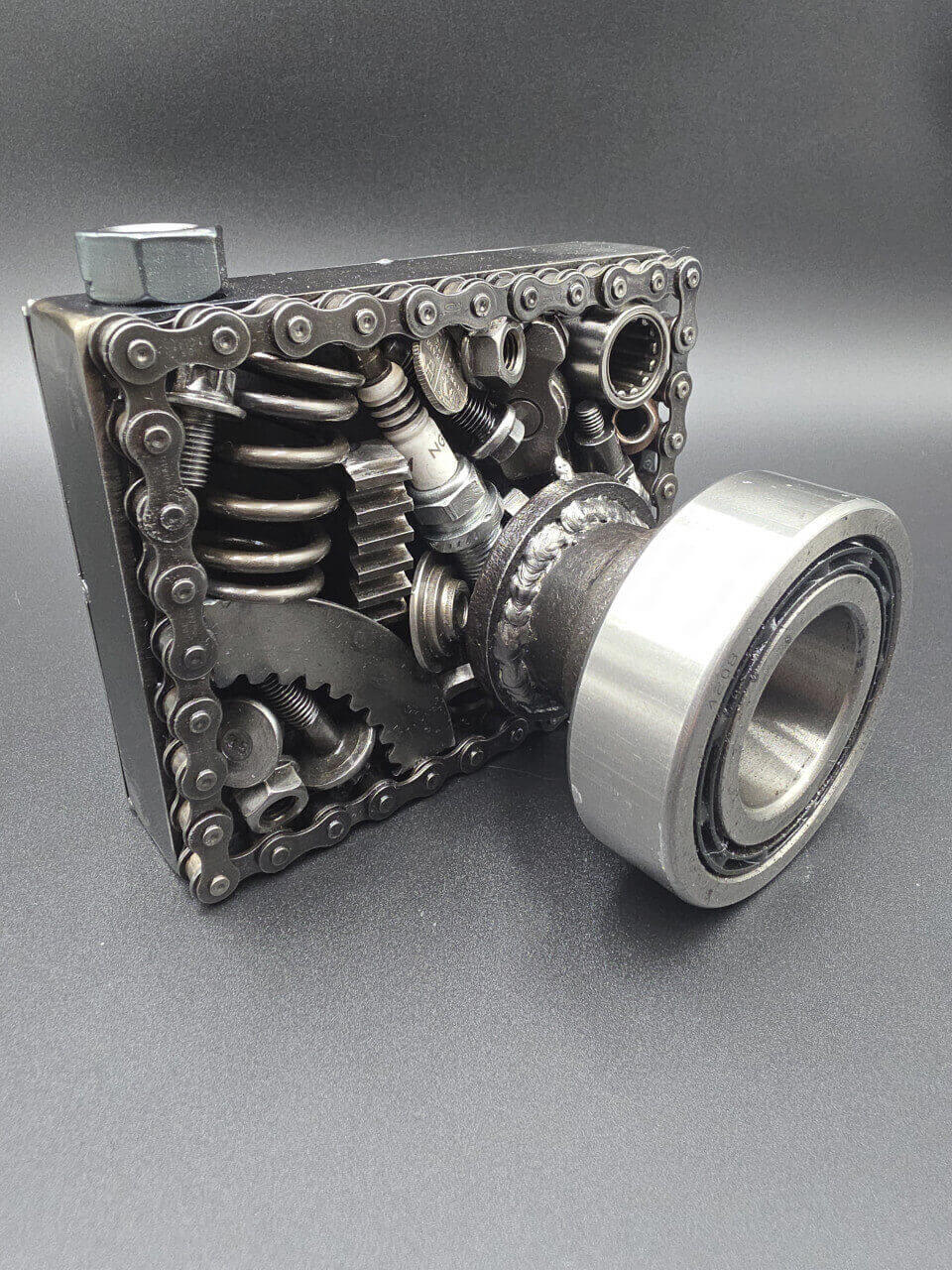 Camera sculpture handmade from chains, bearings and reclaimed metal parts
