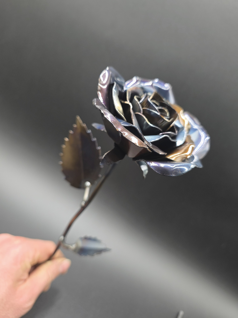 Hand-forged steel rose with a natural heat-coloured finish