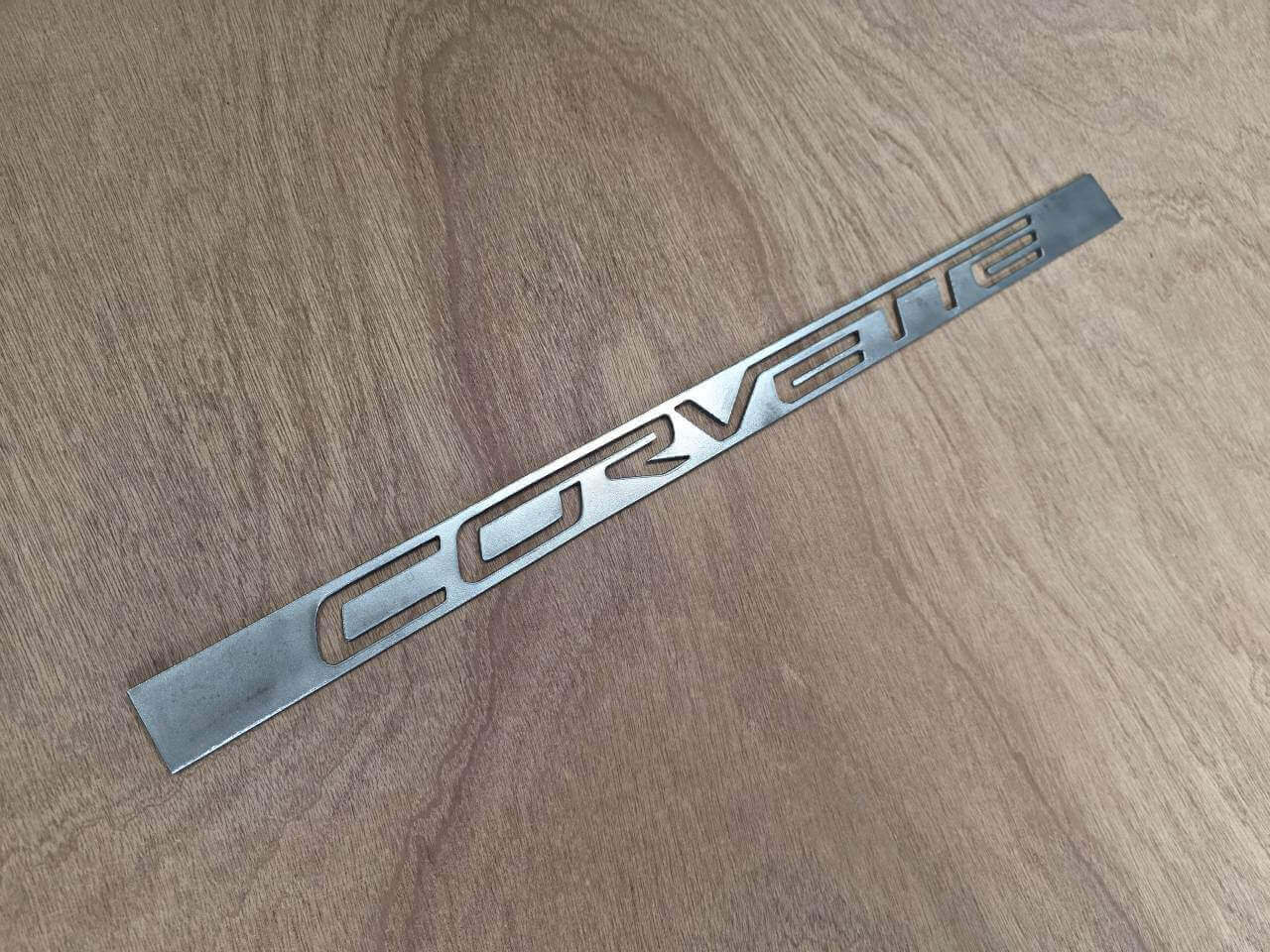 Commissioned Corvette engine plate lettering cut from steel