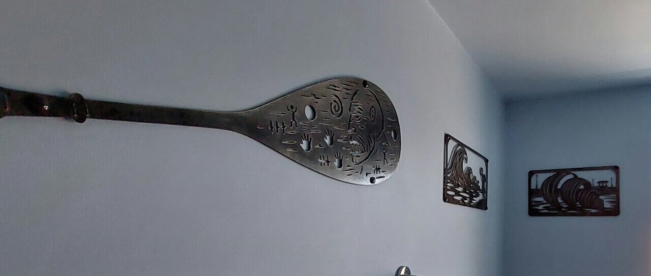 Shell-themed commissioned pieces displayed together on a wall