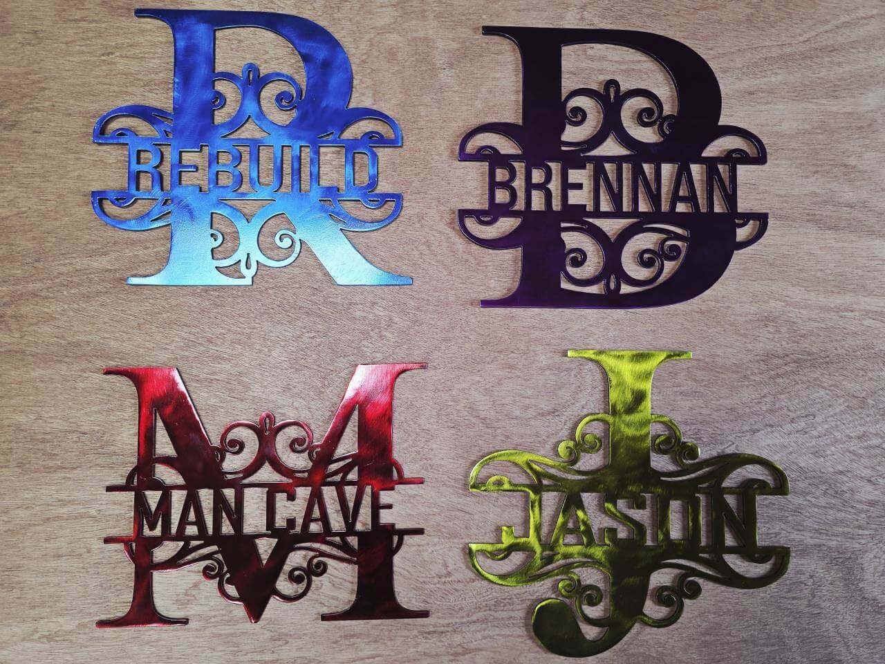 Four commissioned decorative monogram name signs