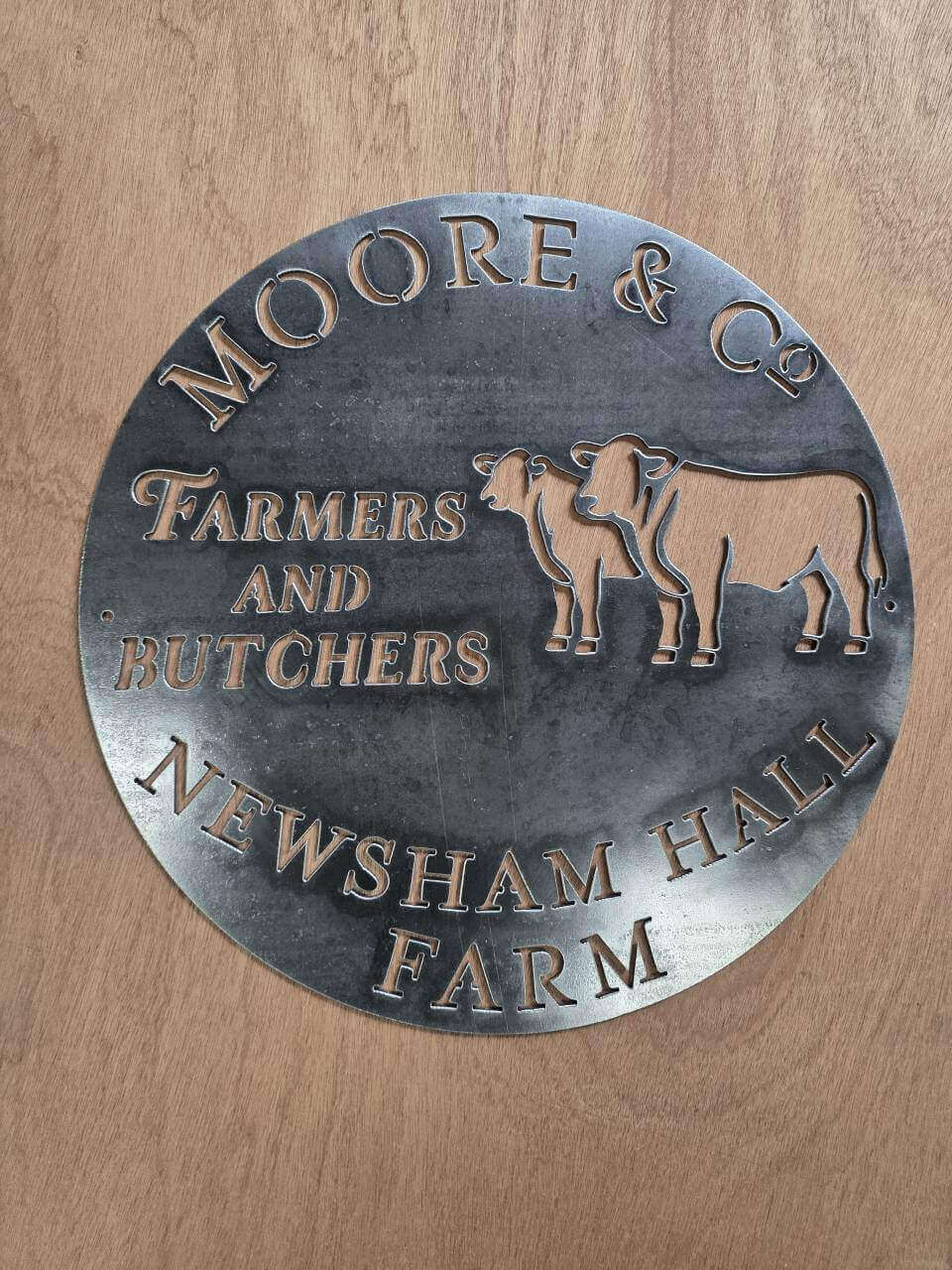 Alternate view of the Moore and Co farm steel sign