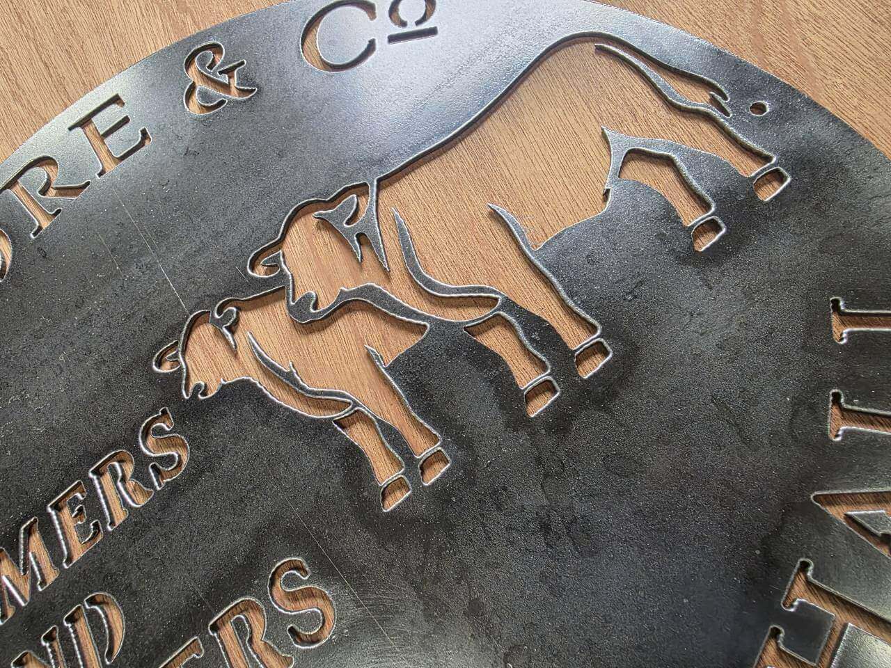 Close-up detail of the commissioned Moore and Co farm sign