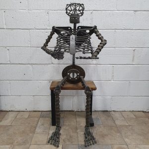 Repurposed Metal Sitting Skelton