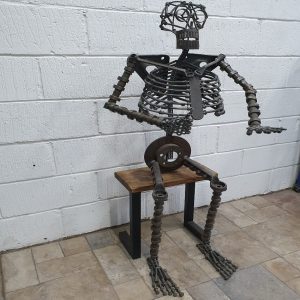 Repurposed Metal Sitting Skelton