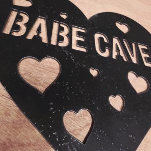 Babe Cave Metal Sign