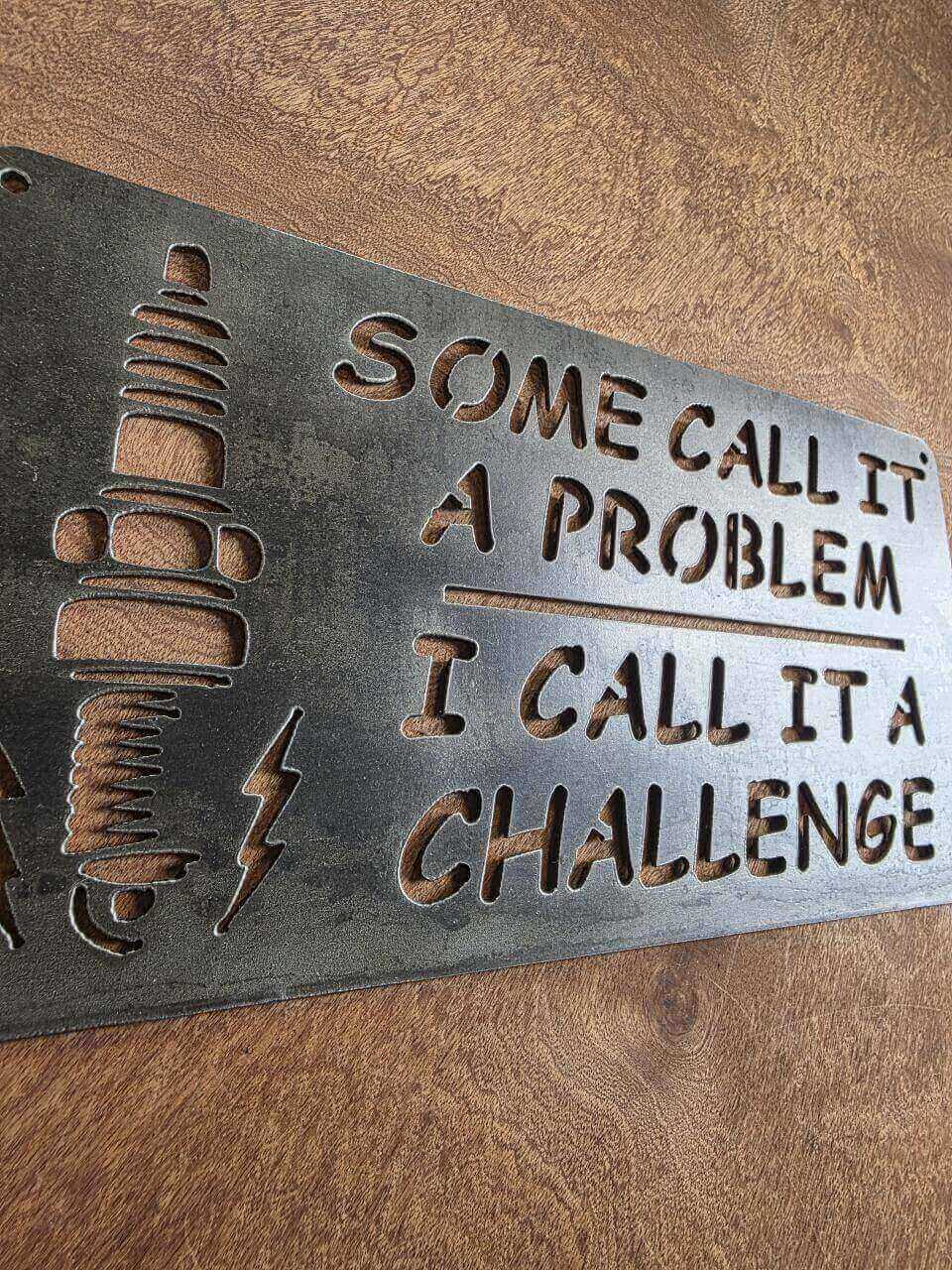 Angled view of Some Call It a Problem metal workshop sign