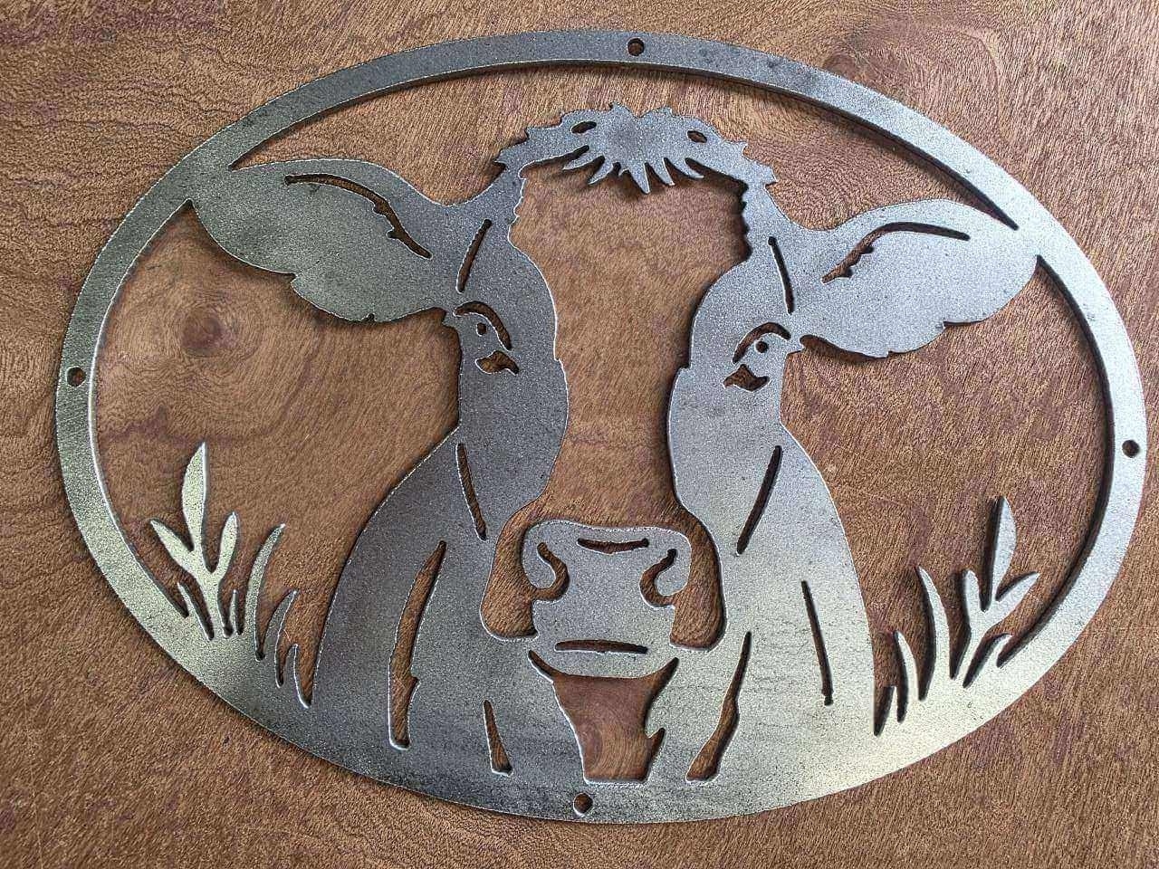 Front view of raw steel cow wall sign