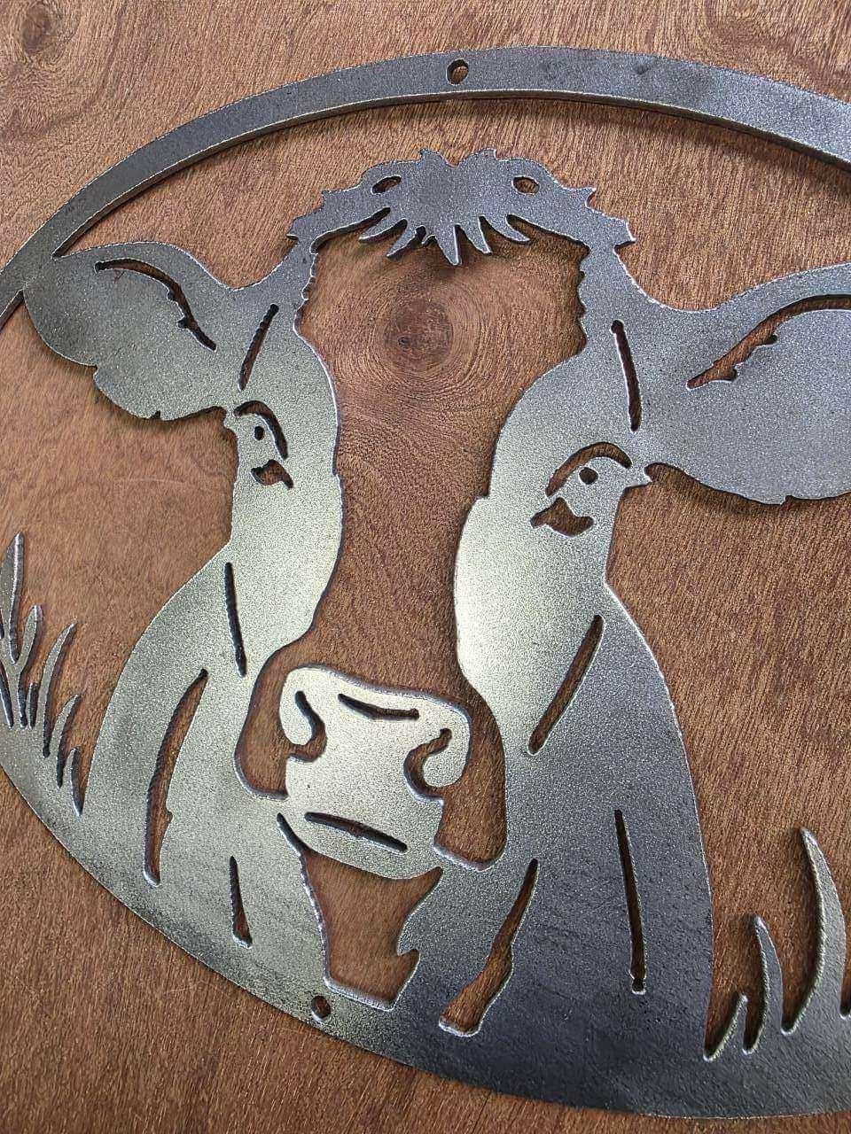 Close-up of plasma-cut cow face and details