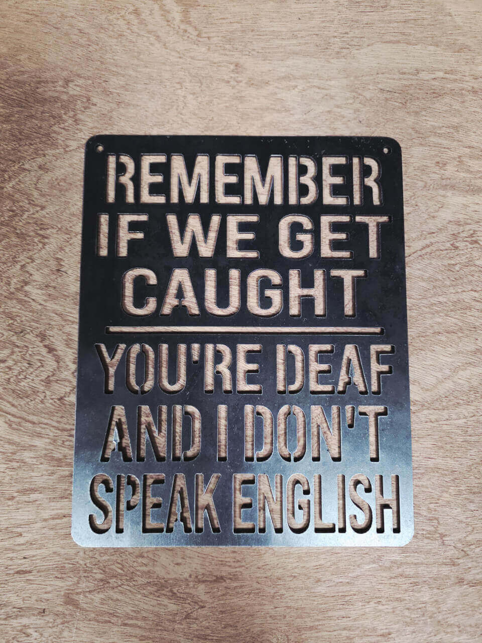 Front view of deaf and do not speak English metal sign
