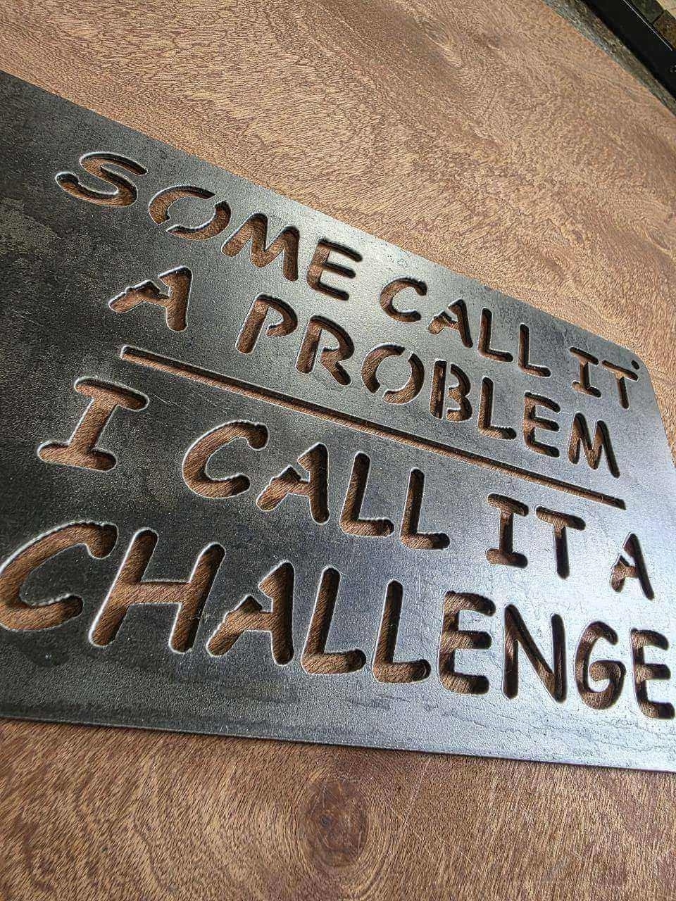 Close-angle view of Some Call It a Problem quote lettering