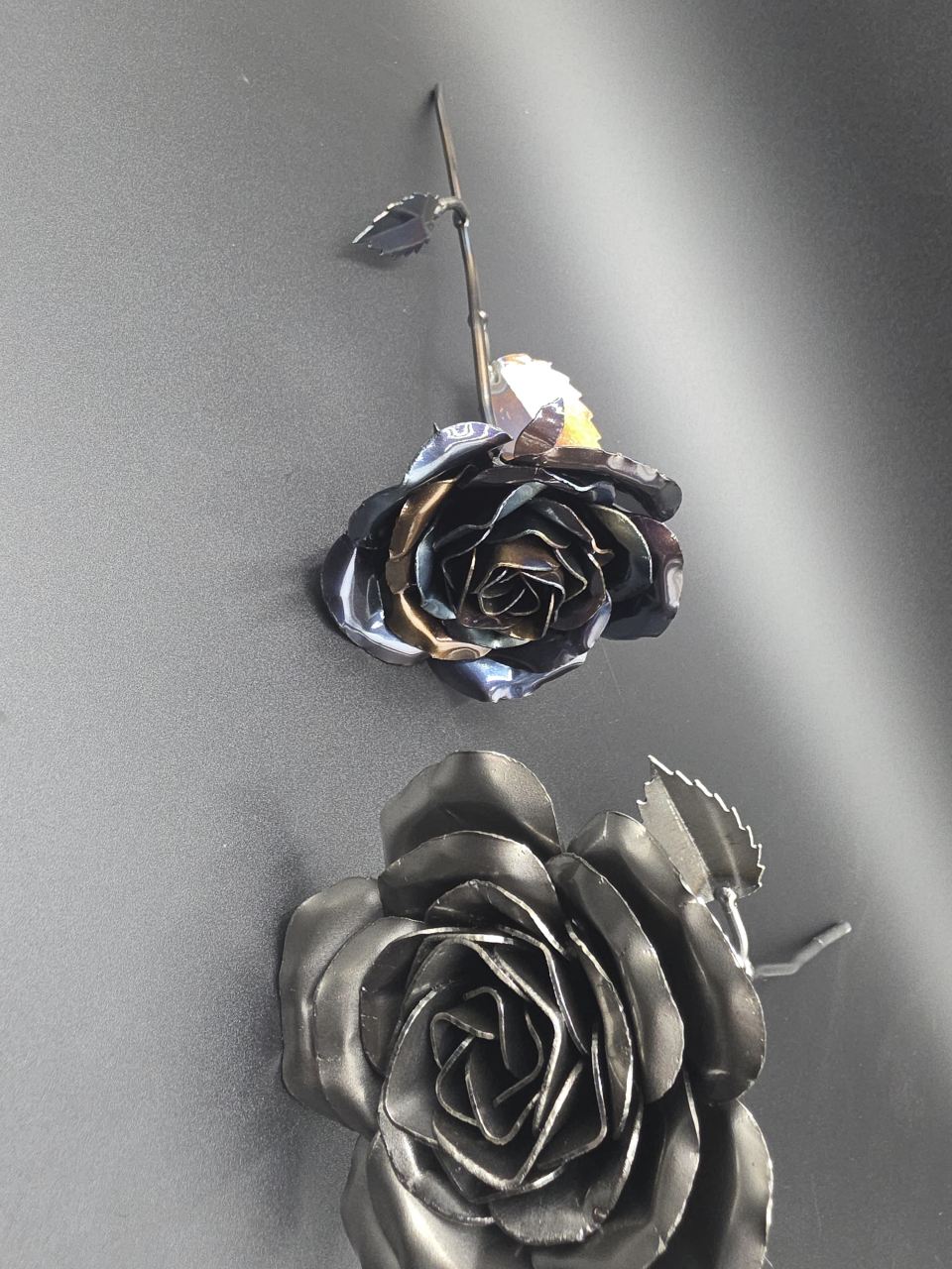 Heat-treated and raw-steel Eternal Roses displayed together