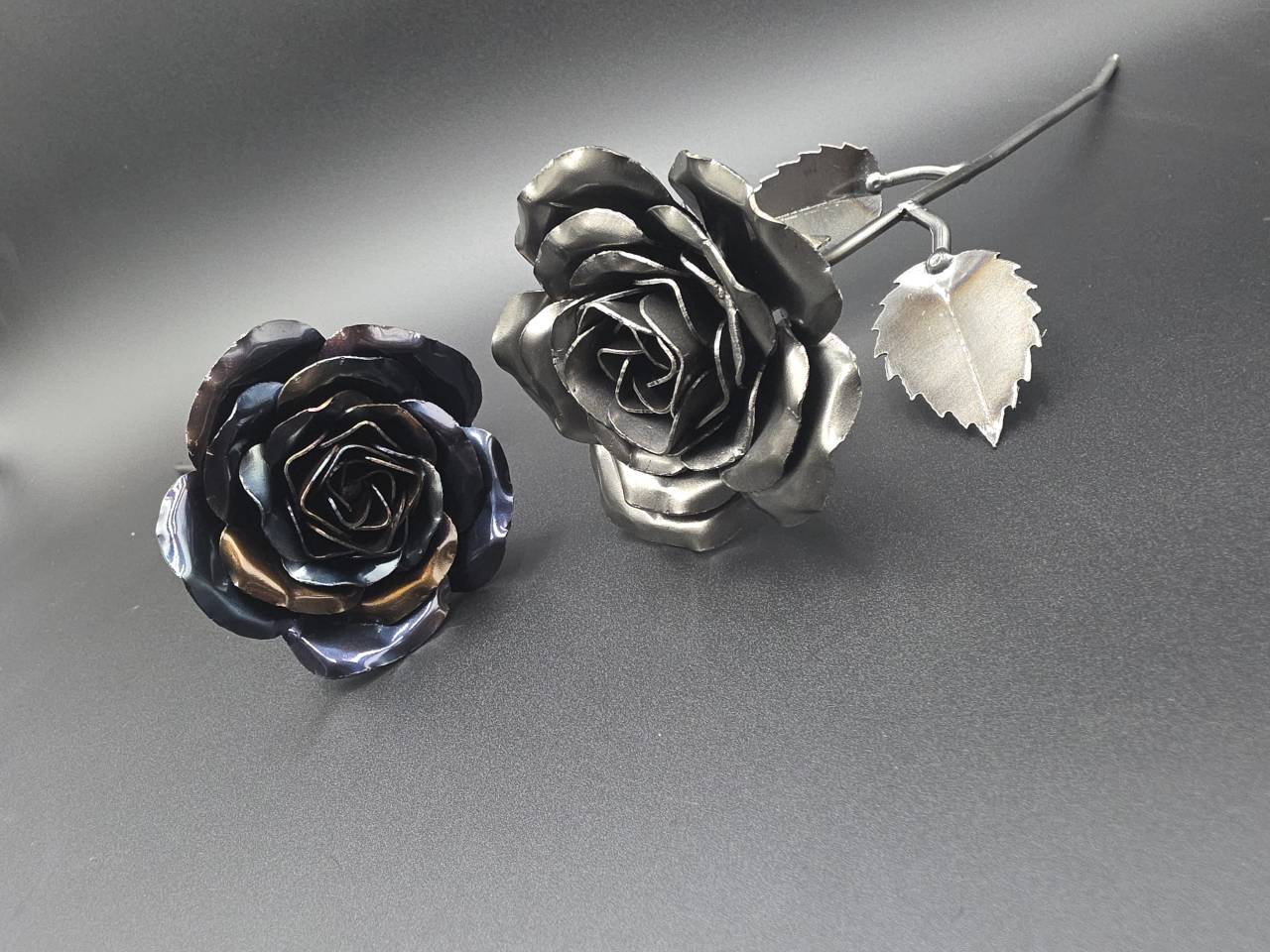 Close view of handmade raw-steel and heat-treated rose heads