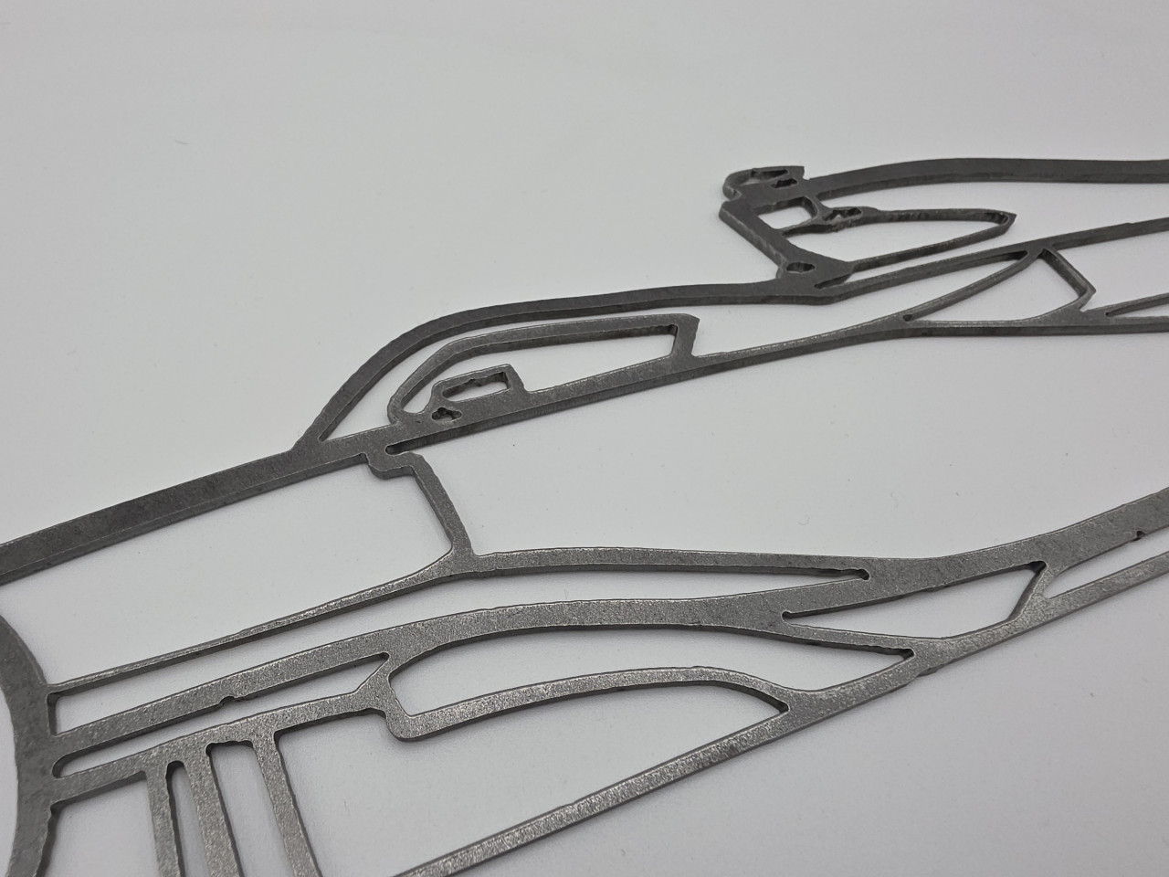 Formula 1 racing car raw steel metal wall art – close-up detail