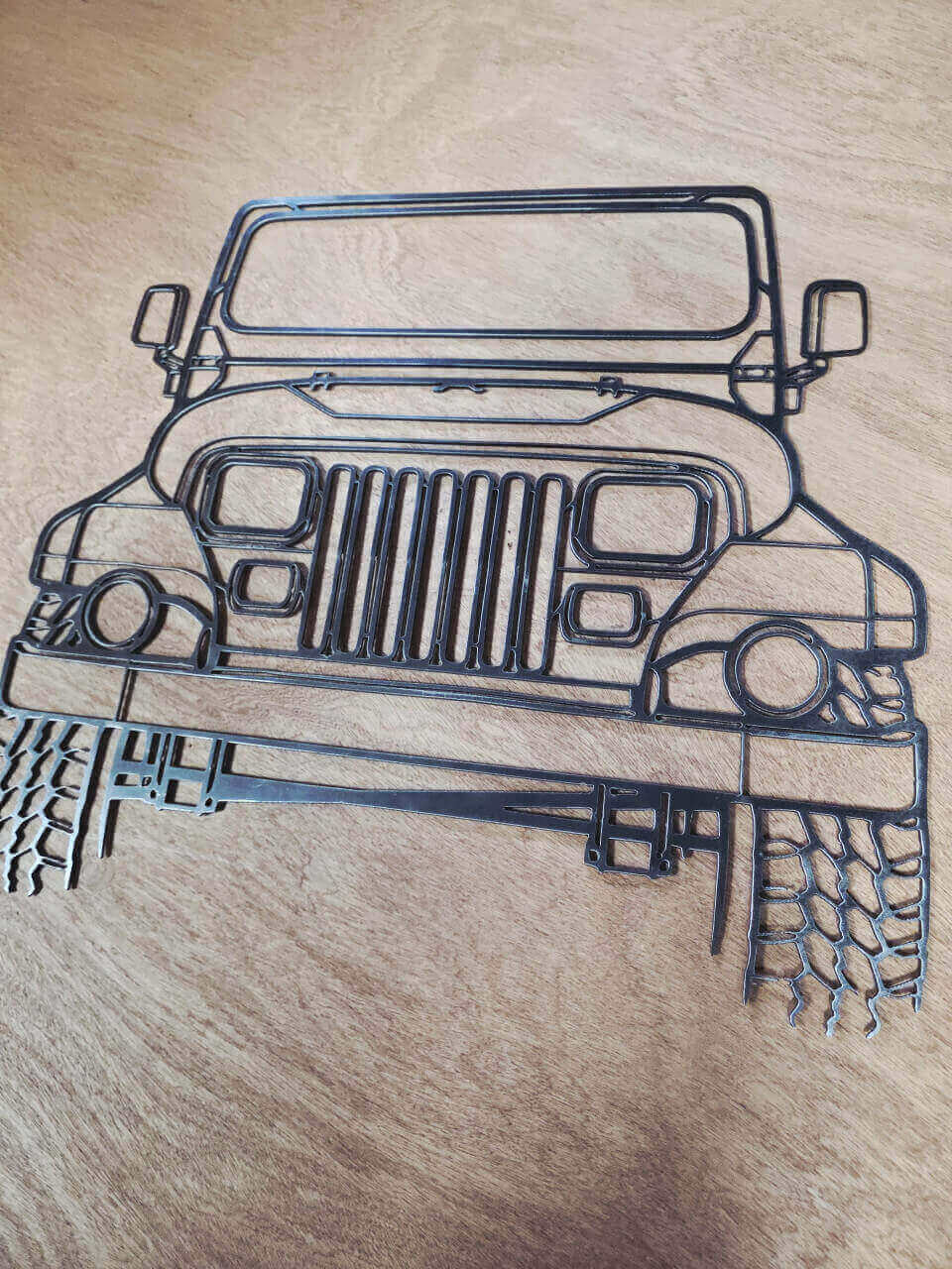 Jeep front-view raw steel metal wall art – close-up detail