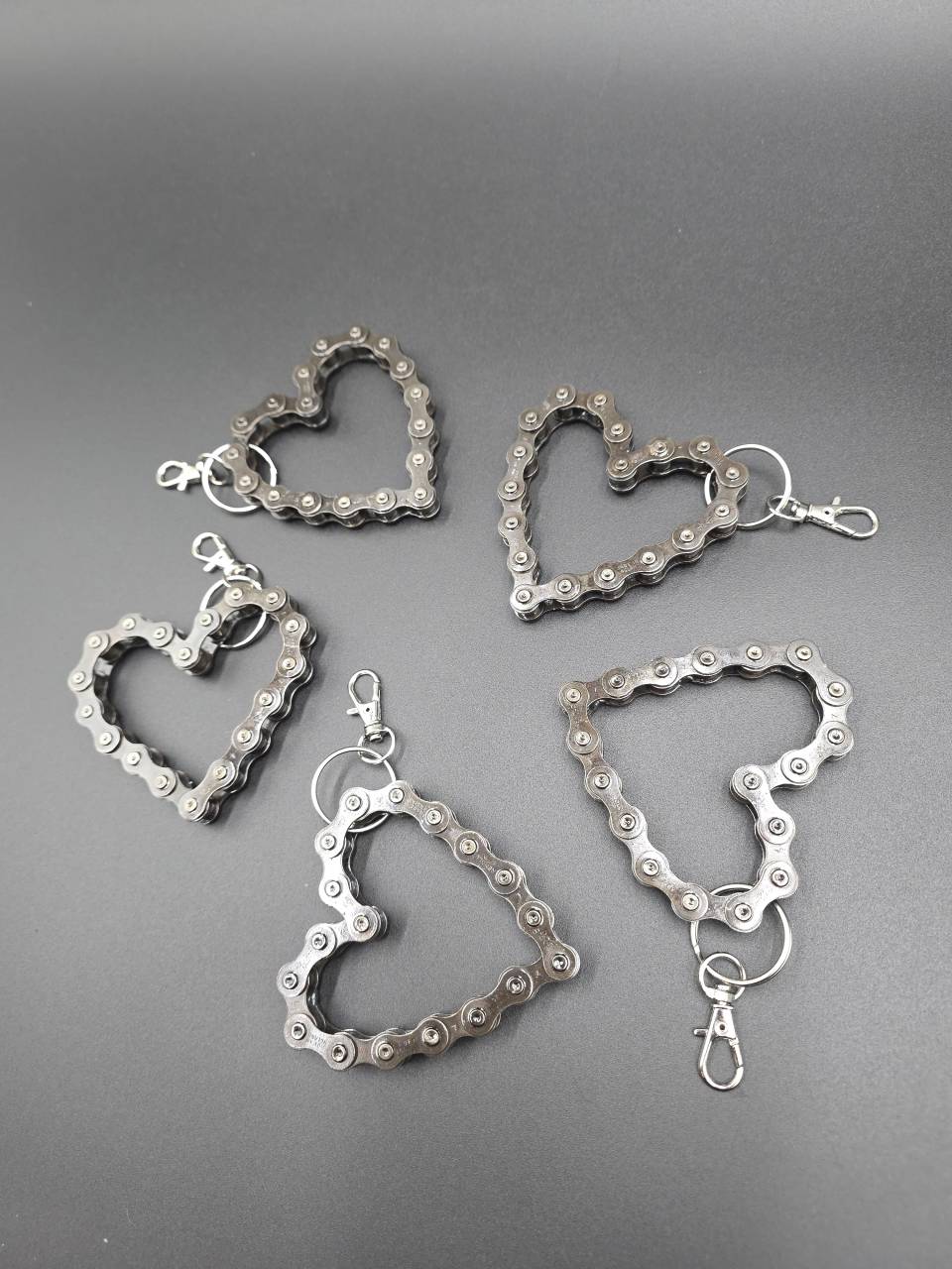 Selection of handmade heart keyrings made from reclaimed bicycle and cam chains