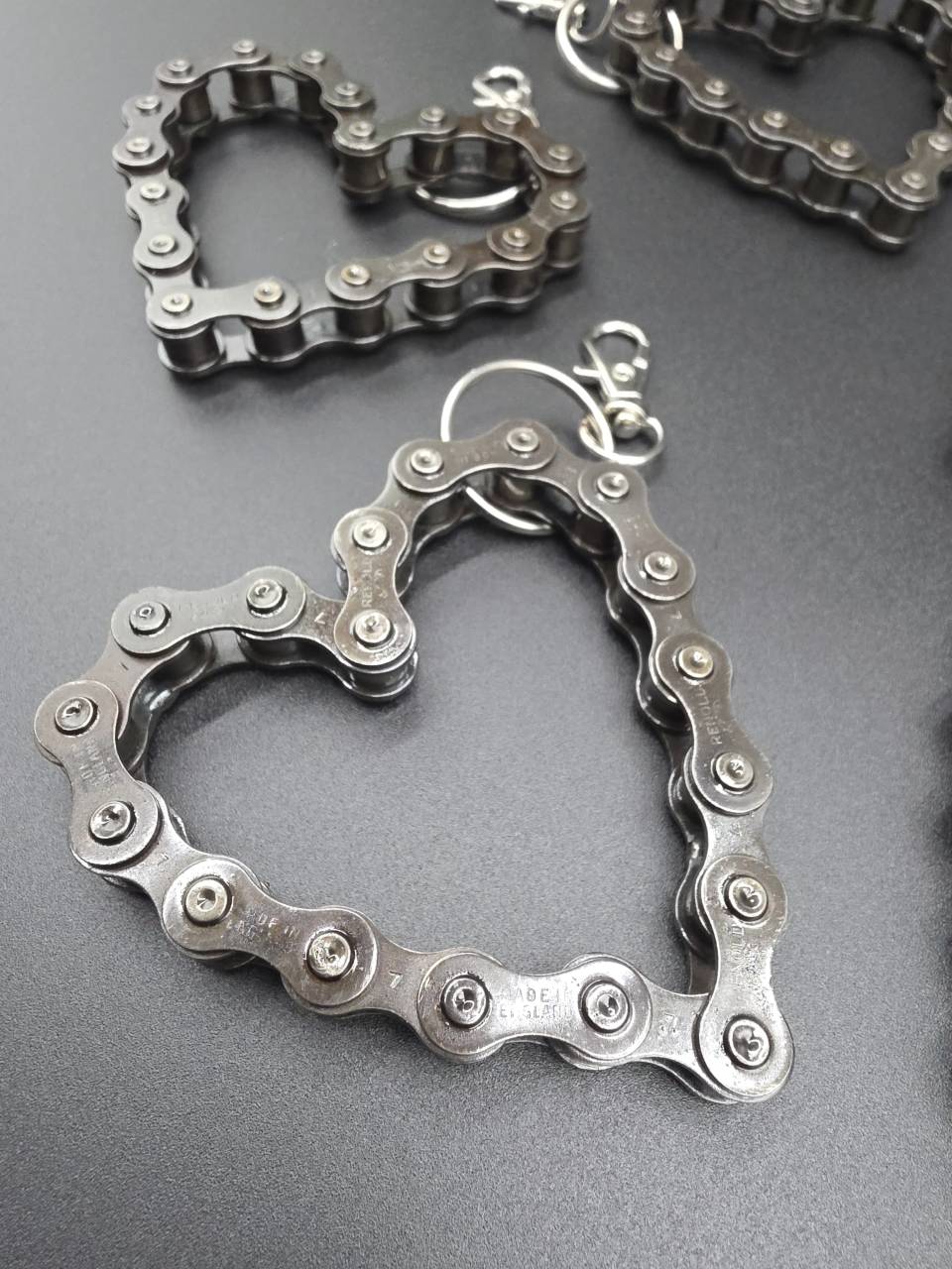 Close-up of a heart keyring shaped from reclaimed mechanical chain