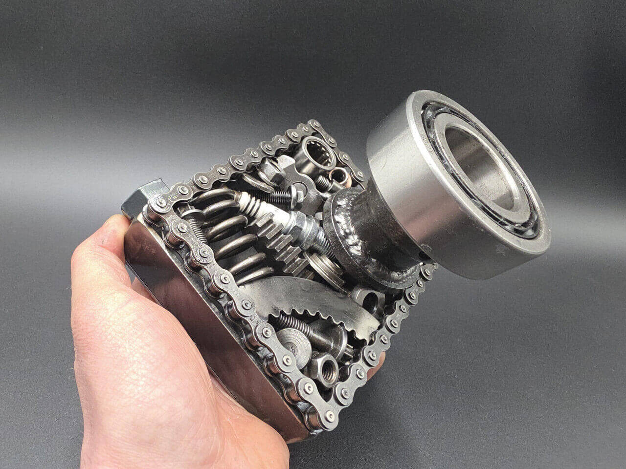 Hand-held view showing the scale of the scrap metal camera sculpture