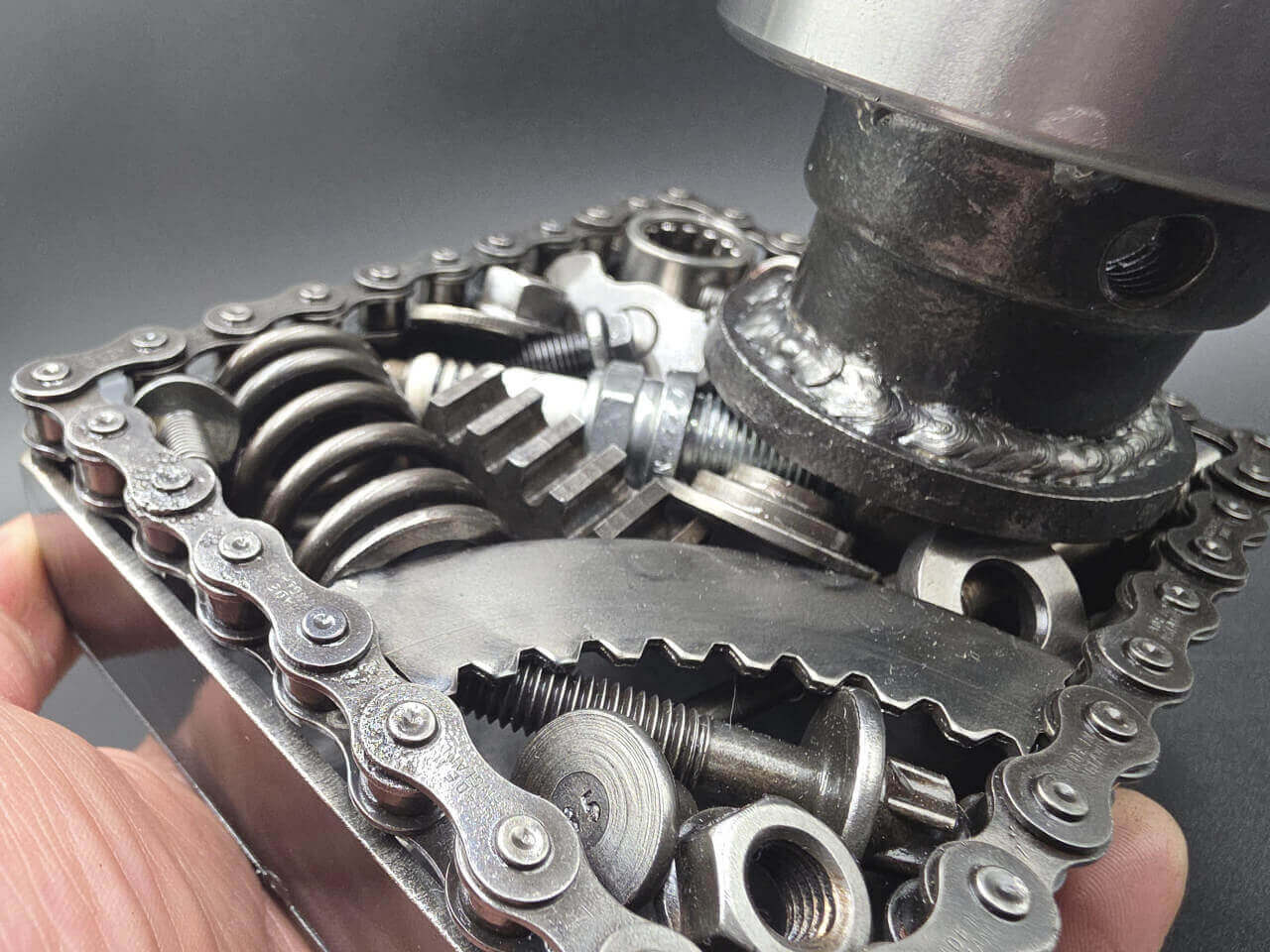 Detailed view of reclaimed automotive parts behind the spinning bearing lens