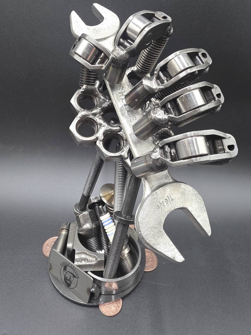 Mechanic’s hand sculpture made from bearings bolts springs and reclaimed steel