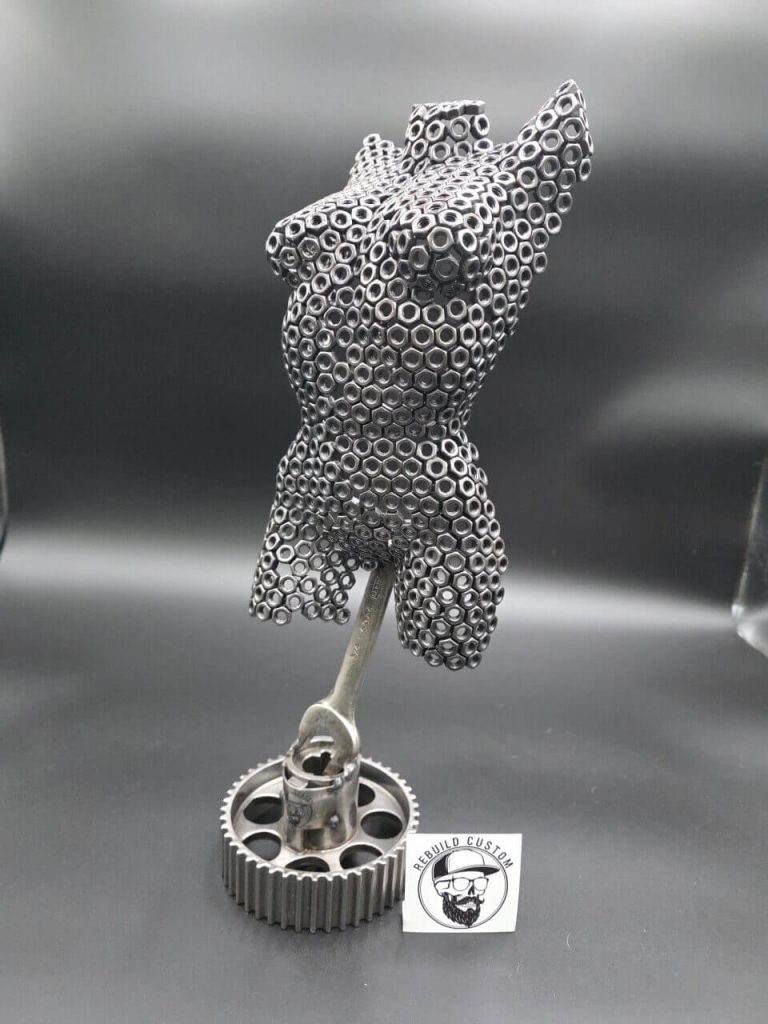 Small Nut Torso front sculpture made from M6 nuts on a spanner and camshaft pulley base