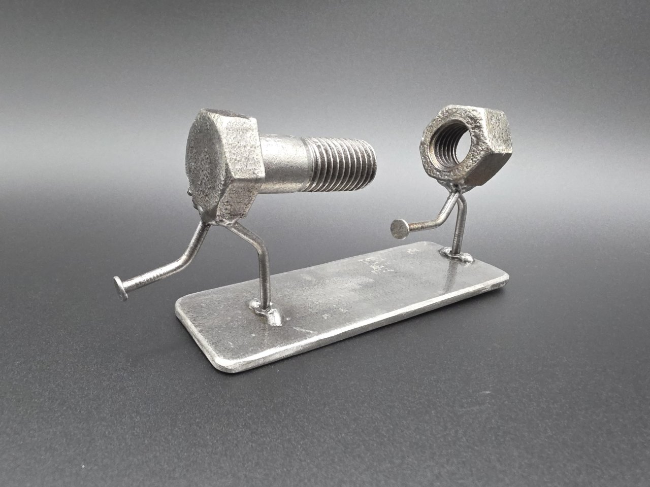 The Chase nut and bolt sculpture on nail legs viewed from the back
